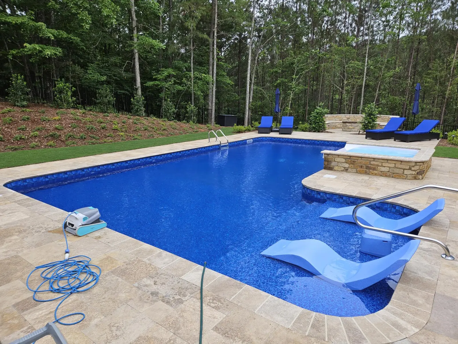 Vinyl liner pool with a tanning ledge and loungers in Trussville
